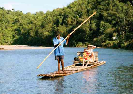 Visitors at Hotel Mocking Bird Hill can board a bamboo raft for a guided tour down nearby Rio Grande River.
